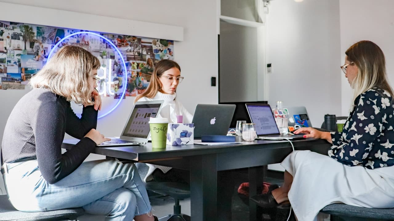 Marketing agency team collaborating in a modern office